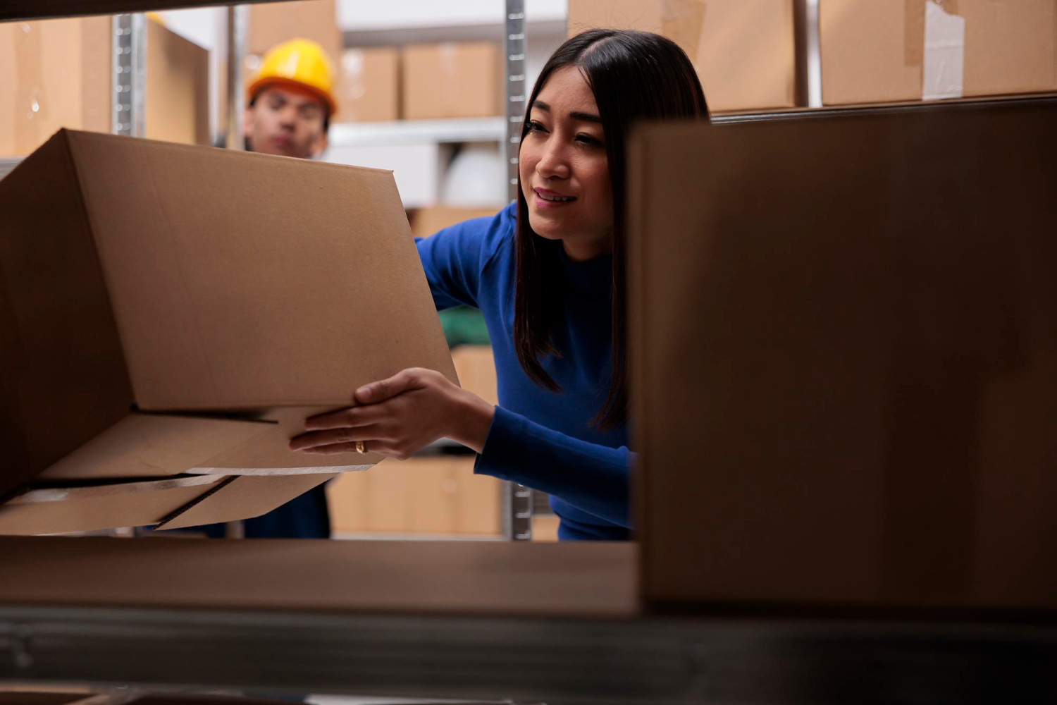 Woman organizing amazon boxes